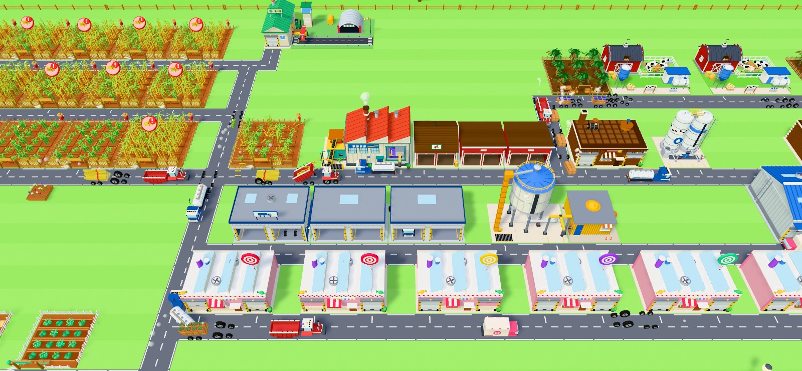 A sweet factory with fields, a sugar mill, factories, a warehouse and trucks on the roads